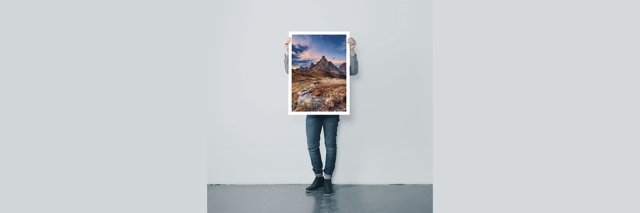 Man holding blank poster